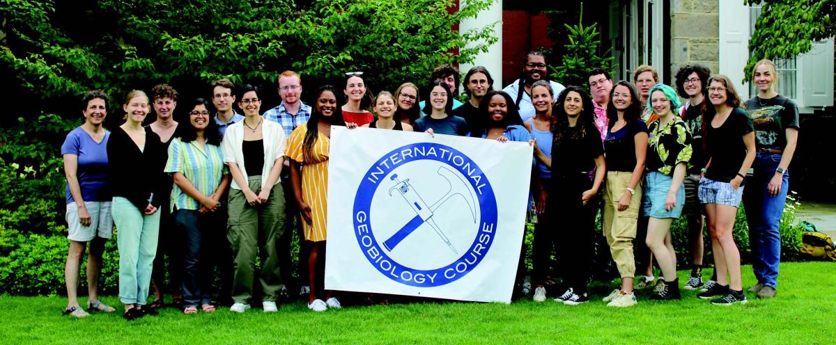 Students in the Geobiology course holding a sign