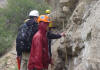 Tony Moscatello and Amri Bukhari in the rain at Book Cliffs