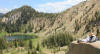 Max rests on a granodiorite boulder above Lake Catherine, Alta stock project