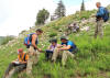 Maureen Feineman helps Nate (standing), Devon (sitting next to Maureen), Everett (in orange), and Ryan(blue flannel), Alta stock project