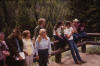 Petrified Tree, Yellowstone  George Burgess at left with brown hat, Bob Lanning second from right, Keith Wilson fifth from right (on fence), Linda Flueckinger Dutcher in blue blouse