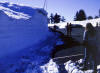 Jayne Rava by a snowdrift at Crater Lake