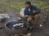 Pat cooks dinner at Hebgen Lake campsite