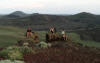 Justin K, Adam B, and Justin G resting on silicified conglomerate, Wildhorse project, central Idaho