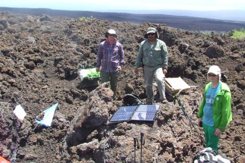 Seismology field crew recovering a seismic station at Sierra Negra caldera, Galapagos Islands, Ecuador.