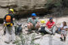 Relaxing on a flat outcrop, Book Cliffs: seated are Jamie, AJ, & Jess